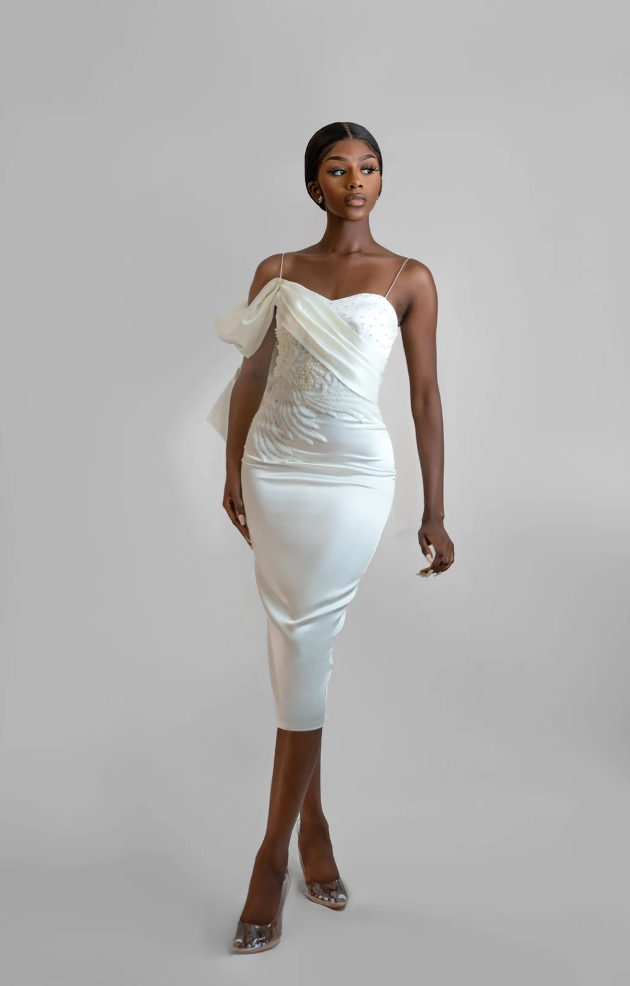 model in body con white dress with one shoulder strap detail