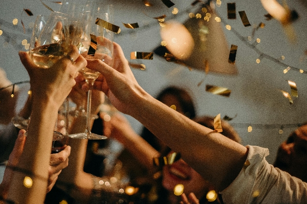 guests celebrating after teh wedding with wine and beer