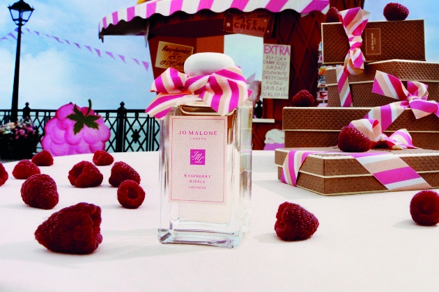 Jo Malone Raspberry Ripple fragrance surrounded by raspberries