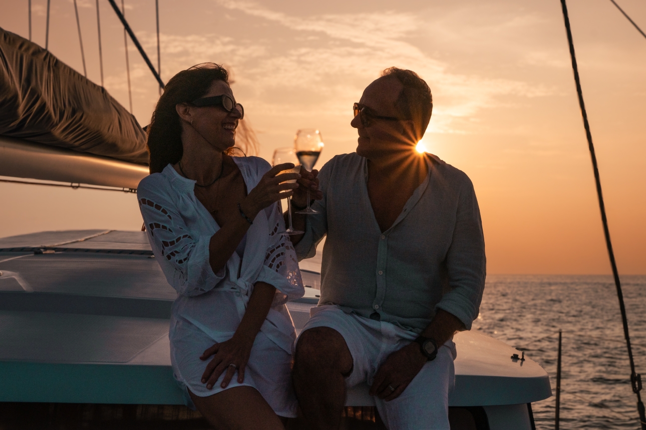 couple on yacht at sunset