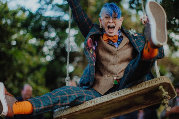 person in tartan suit on swing