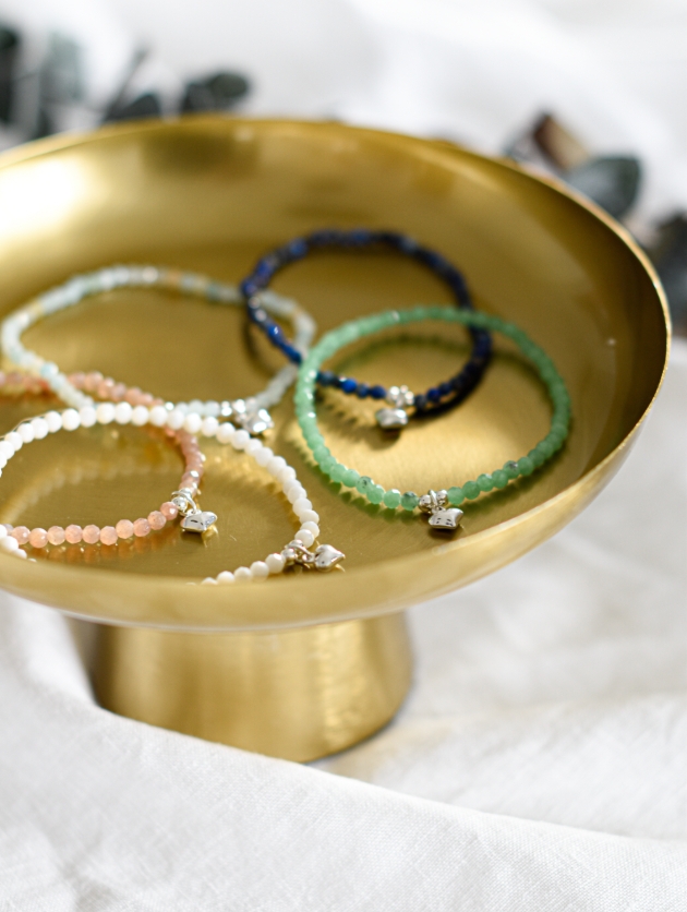 beadd bracelets in brass bowl