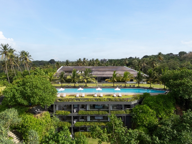 An outdoor pool surrounded by trees