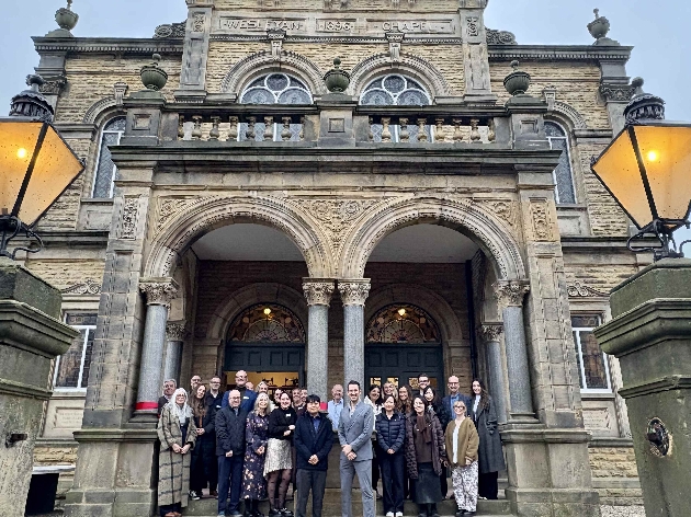 Dishang employers on steps of new office 