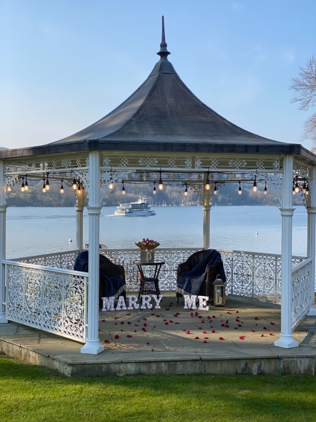 A gazebo with Marry Me light up letters