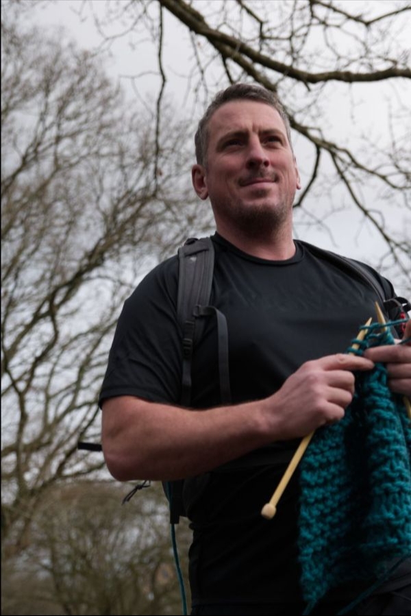 Marathon runner running while knitting