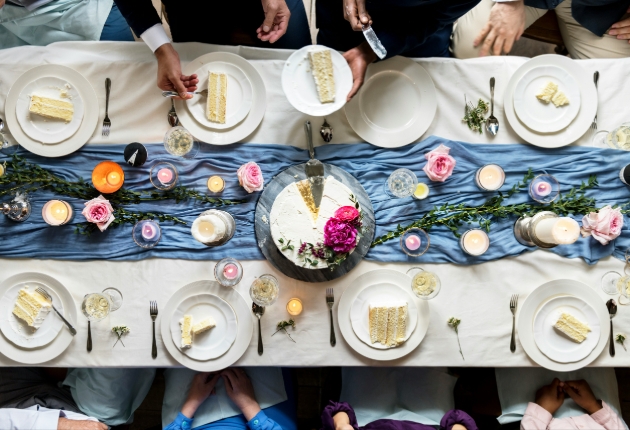 Wedding guests enjoying cake