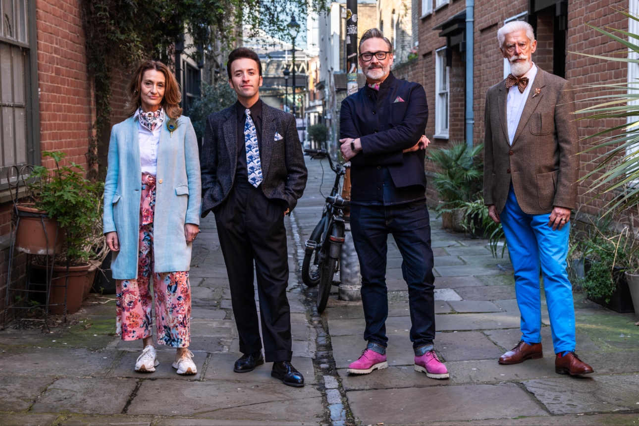 four people, men and women, in outfits with different colours and accessories