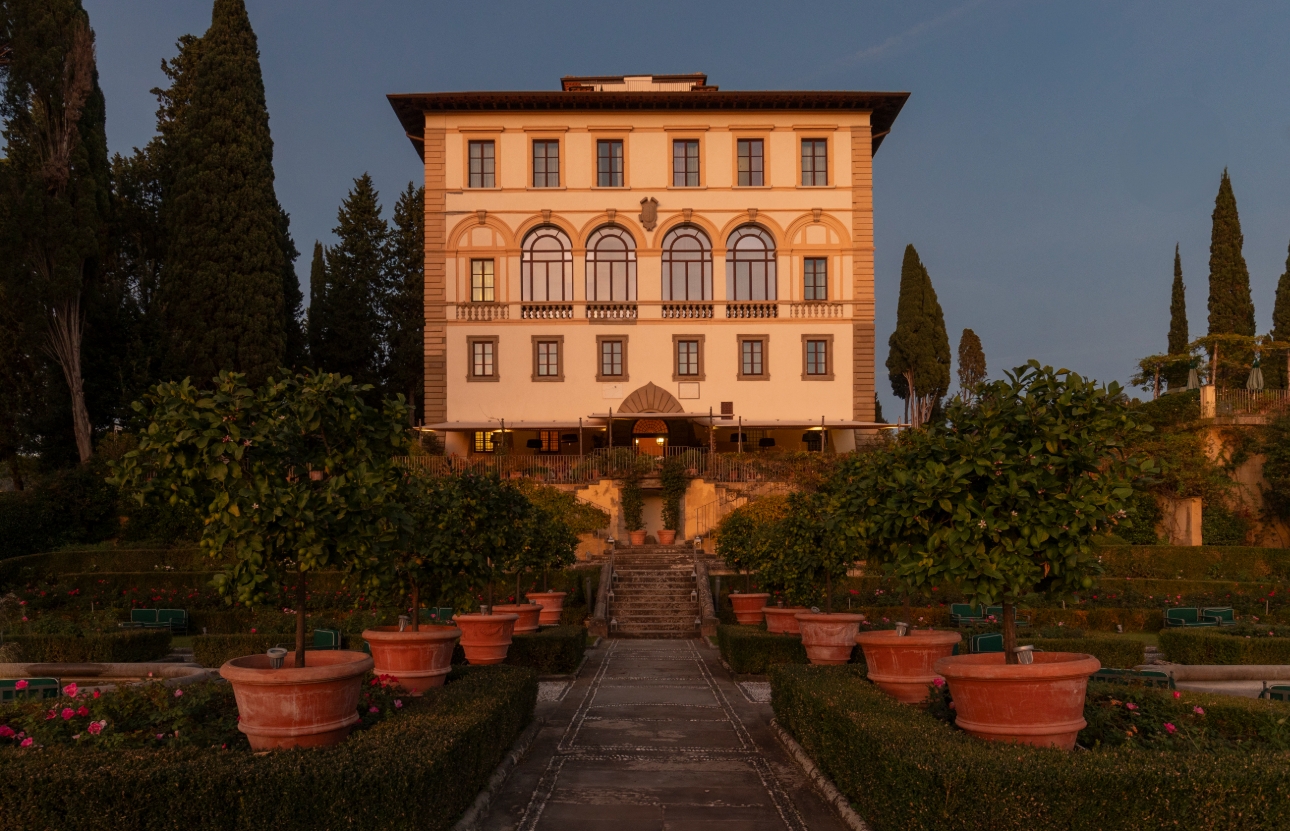 hotel with an orange grove courtyard leading to stairs